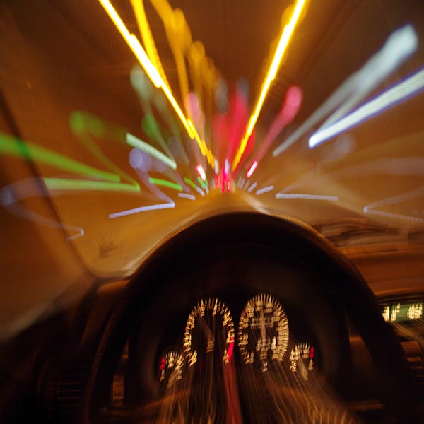 Blurred motion car drivers view traveling through tunnel